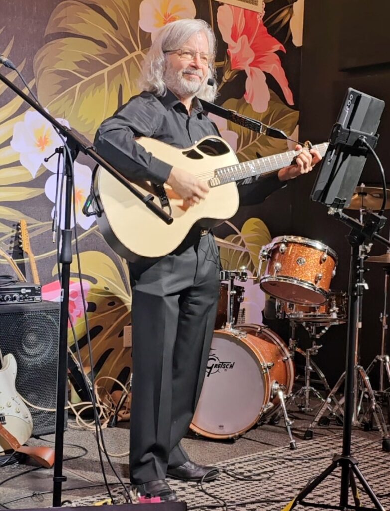 Ken Holm playing guitar